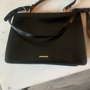 Black leather bag with gold details
